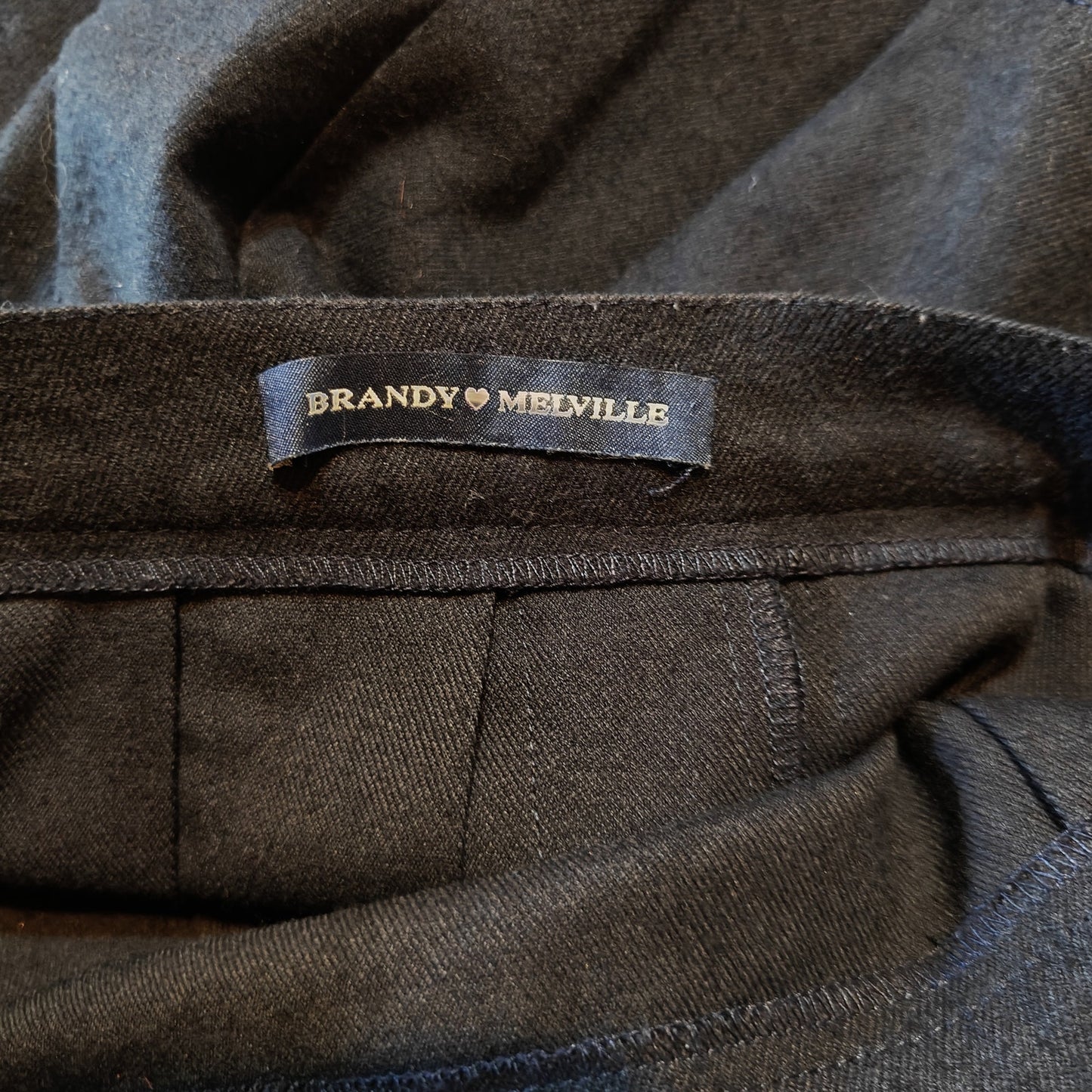 Black Pleated Mini Skirt With Buckle Detail